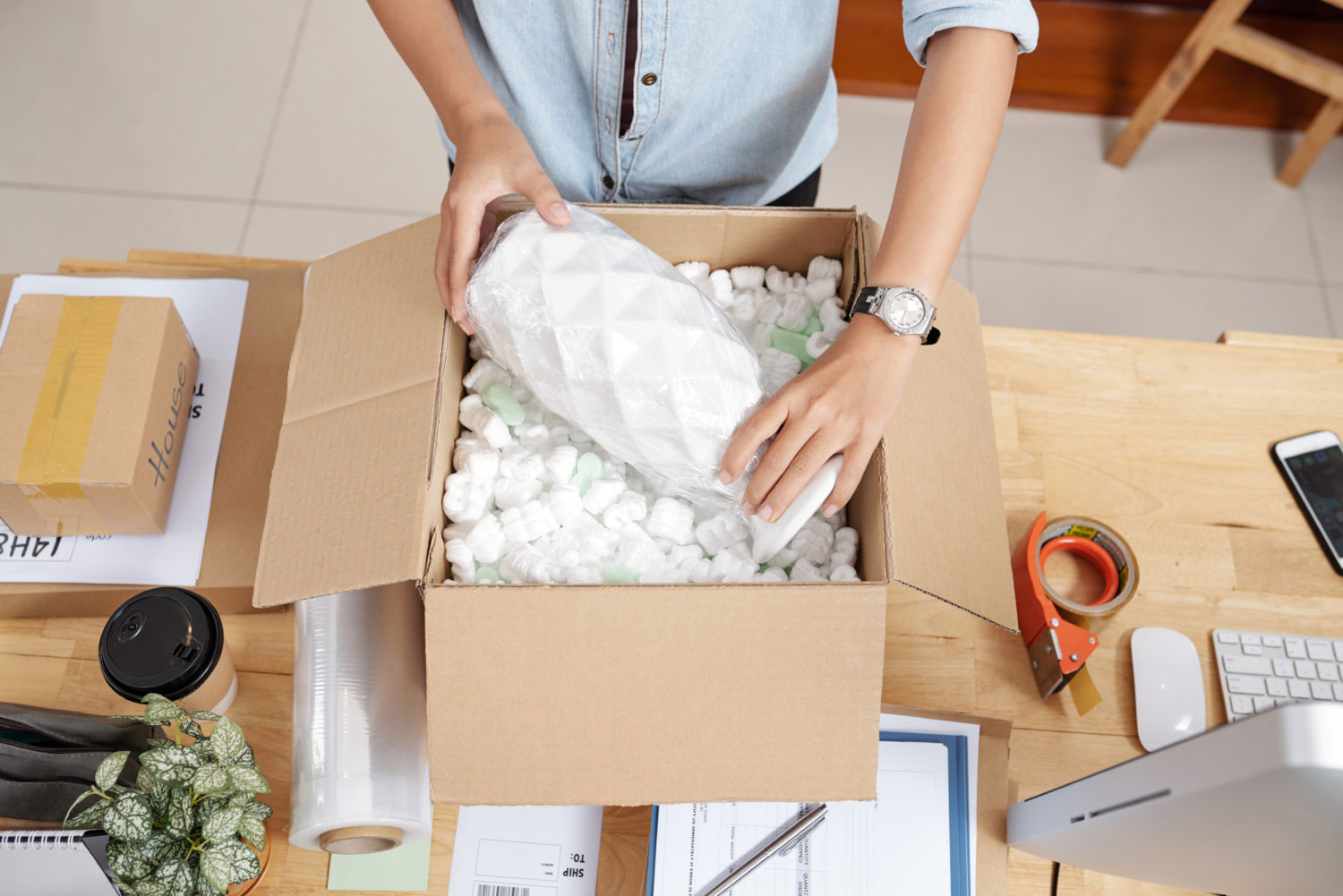 Woman Packing Vase